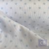 Tela Piqué de Canutillo Blanco con Estrellitas Azul Clarito - Conchi Berguño