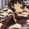 Tela tapicería piel de vaca, fondo vainilla y manchas marrón, imitación sin pelo - Conchi Berguño