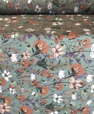 Tela de Mantel Resinado Culla de Flores Emma y Fondo Verde - Detalle de la tela en mesa - Conchi Berguño