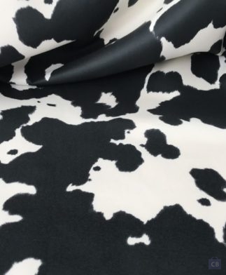 Tela de tapicería sin pelo imitando piel de vaca blanca y negra - Detalle de la Tela - Conchi Berguño